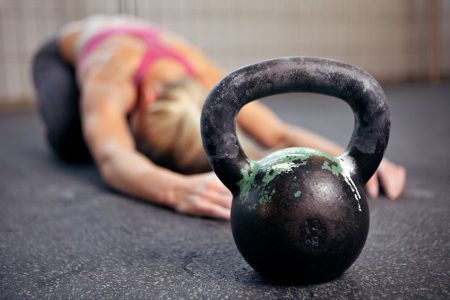 Muscular Strength and Endurance Programming for Women 2 female stretching with kettlebelll